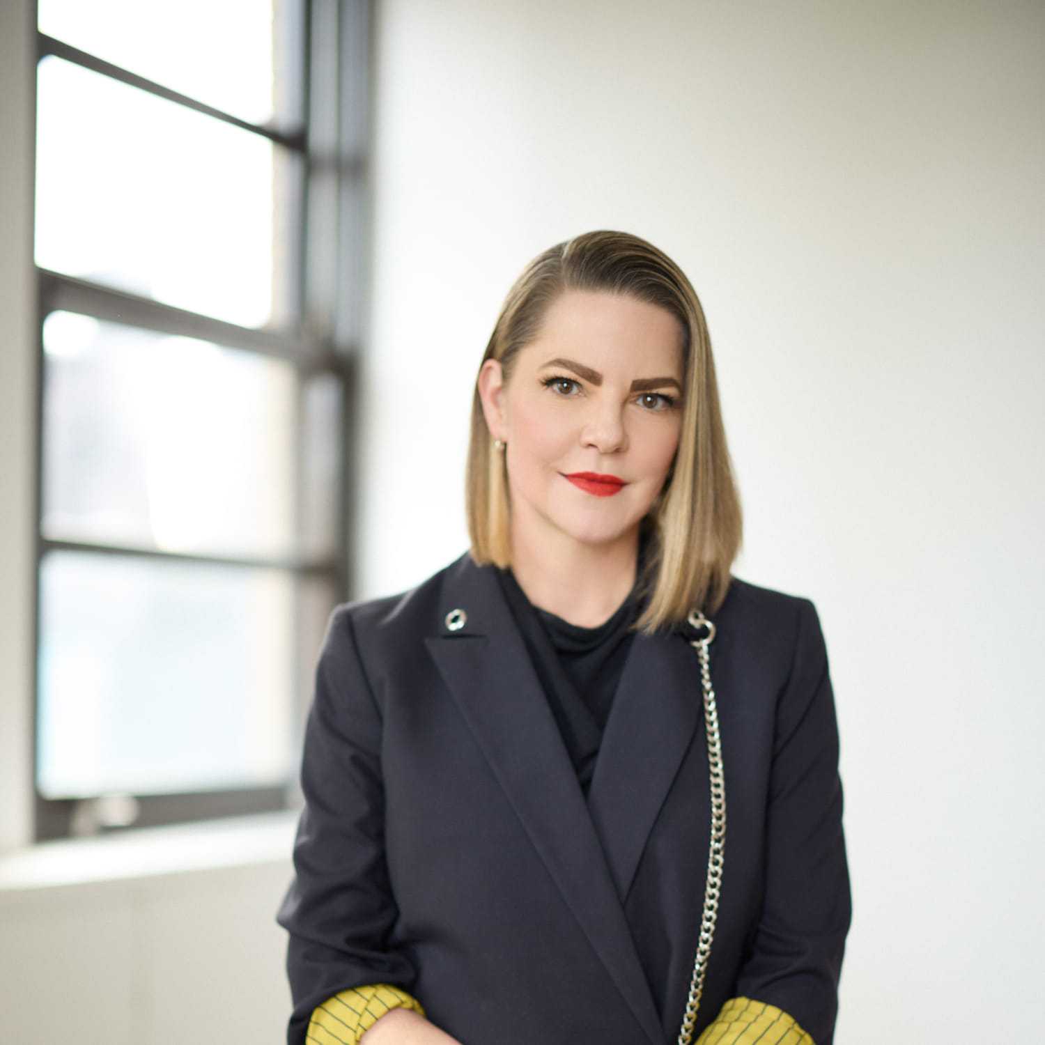 Portrait of Sheridan Pennington, a professional stylist at Mizu Louis Licari, showcasing their expertise and style.