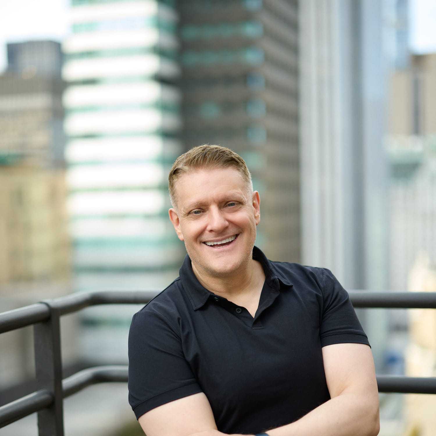 Portrait of Ray Symons, a professional stylist at Mizu Louis Licari, showcasing their expertise and style.