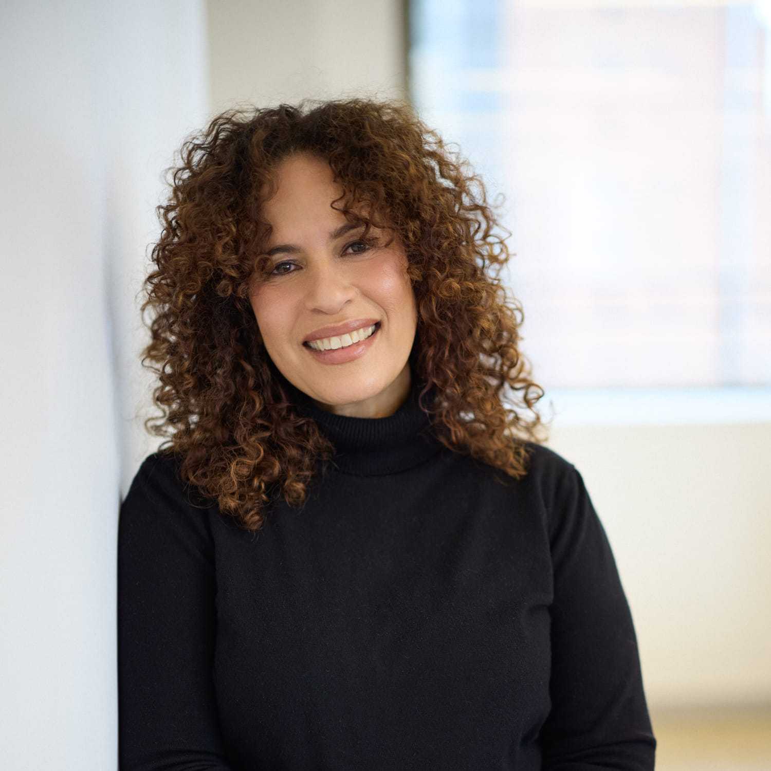 Portrait of Raisa Cabrera, a professional stylist at Mizu Louis Licari, showcasing their expertise and style.